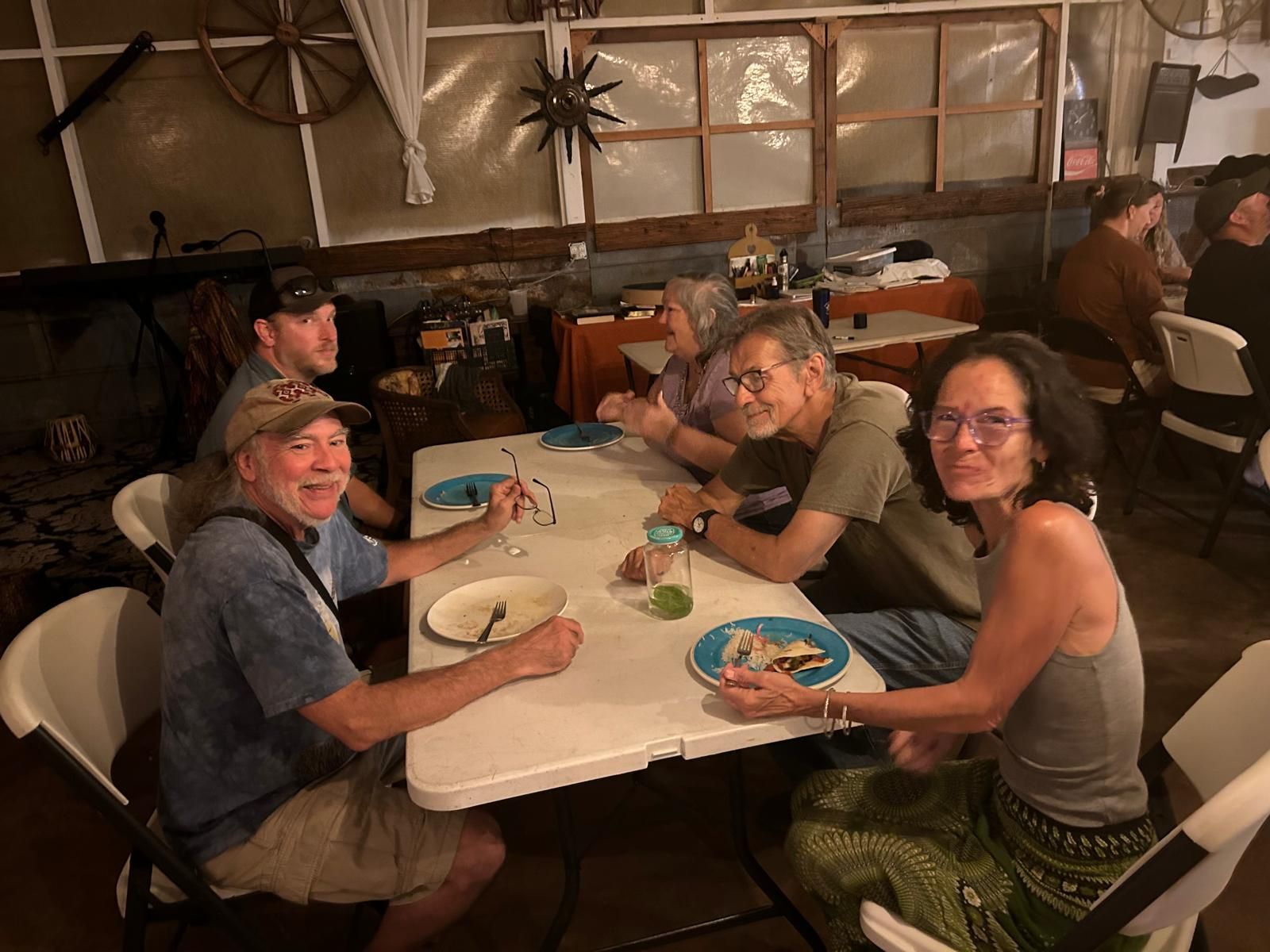 People sharing a meal, from the existing Guild website